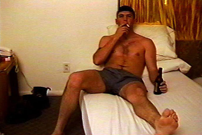 Hunky Marine Chugs a Beer Image